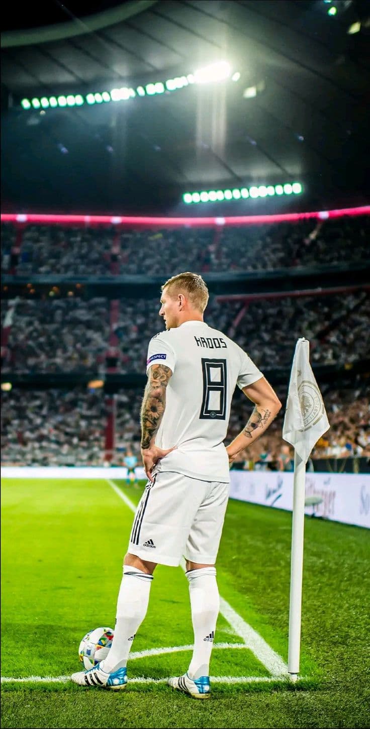 A clean, minimalist workspace with a single laptop showing a code editor and a green 'success' terminal.